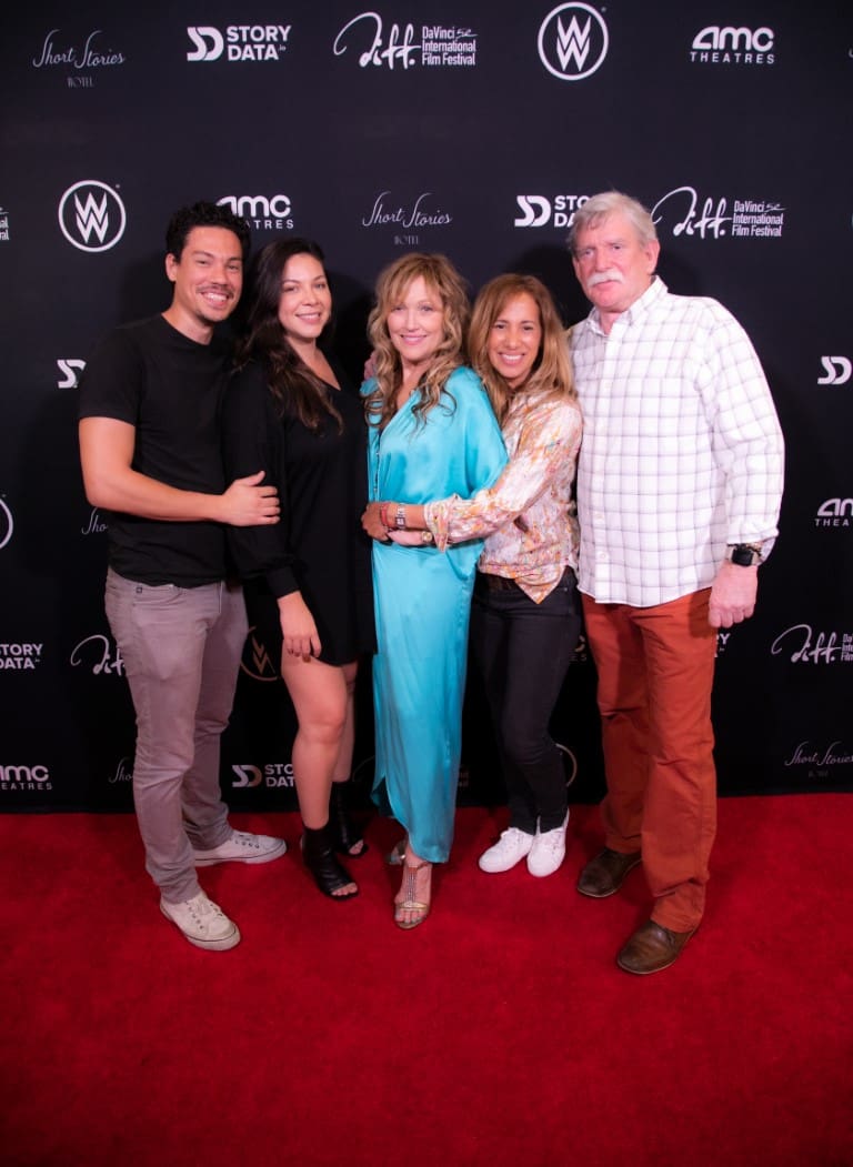 A photo of Tamara, Marc, and guests on the red carpet.