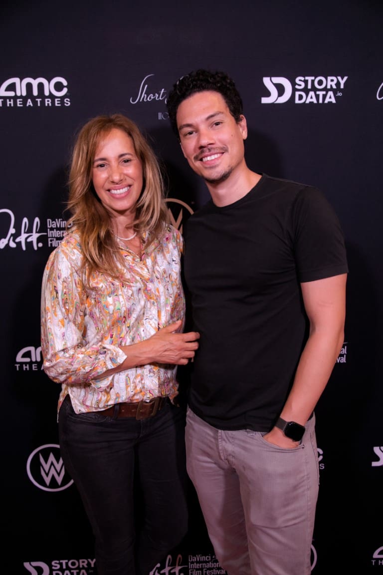 A photo of individuals on the red carpet.