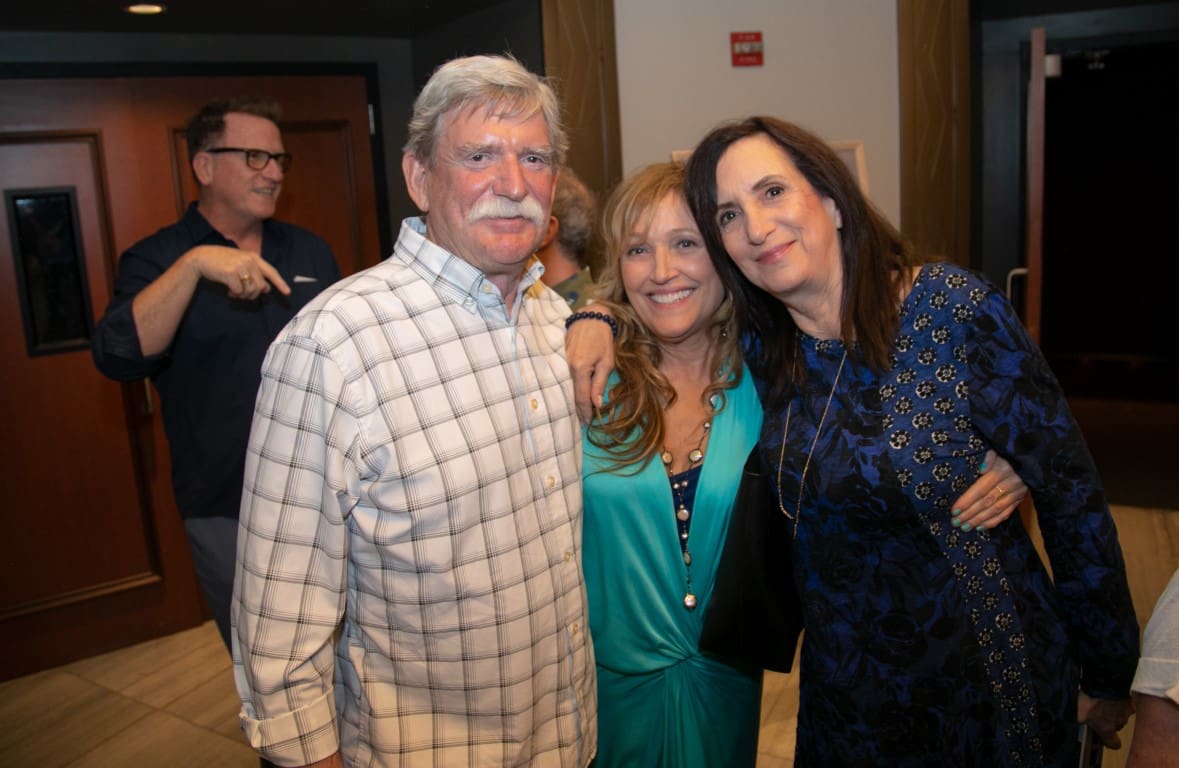 A photo of Tamara, Marc, and friend at a screening.